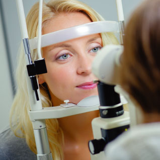 woman looking at patient's eyes